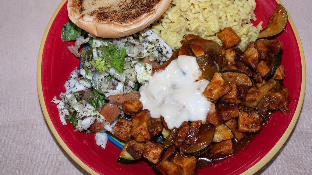 Spicy Teriyaki Chicken · Served with rice pilaf, garlic bread, vegetables and salad.
