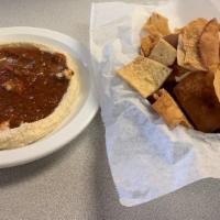 Hummus · Served with salsa and chips or oil and pita bread.