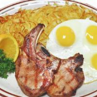 #19. 2 Pork Chops & 3 Eggs · Served with 3 eggs, hashbrowns, toast & jelly.