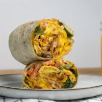 Veggie Breakfast Burrito · A warm flour tortilla filled with scrambled eggs, jack cheese, cheddar cheese, avocado, pico...