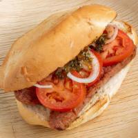 Argentinian Sausage Pepito (Sandwich) · Grilled Argentinian Sausage with tomato, onions, and Chimichurri sauce.