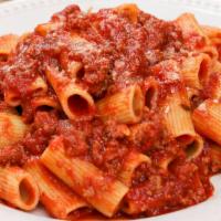 Pasta With Meat Sauce · Served with bread and salad.
