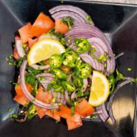 Onion Salad · With lemons and green chili.