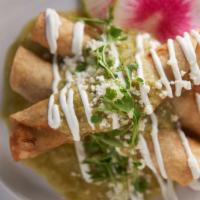 Braised Short Rib Taquitos · Corn tortillas filled with slow braised beef, tomatillo jalapeno salsa, cotija cheese, crema...