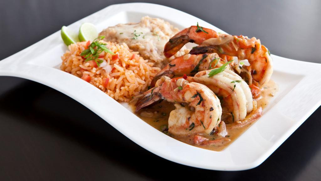 Prawns Pacifico Con Salsa · Jumbo Mexican prawns sauteed in garlic, tomato red onion, crushed chile, tequila lime. Served with Spanish rice, refritos blanco and queso fresco