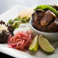 Sabor De Mexico Carnitas · slow cooked pork carnitas, guacamole, crema fresca, red onion, cilantro, chili red onion. se...