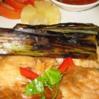 Bbq Salmon · Seasoned fillet salmon wrapped in banana leaves then grilled; served with Thai chili lime sa...