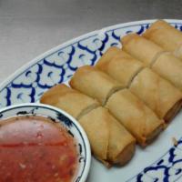 Vegetarian Spring Roll · Stuffed with cabbage, carrots, celery, and grass noodles; served with plum sauce.