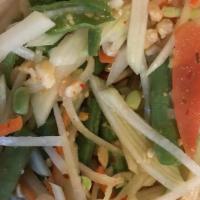 Som-Tum (Papaya Salad) · Spicy. Thailand's most popular salad. Shredded green papaya mixed with carrots, green beans,...