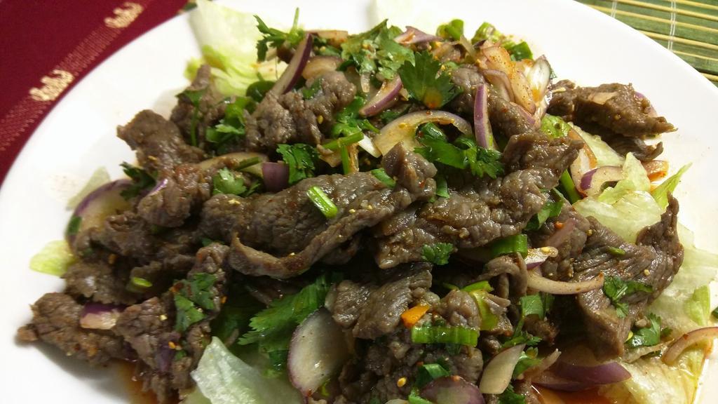 Spicy Salad · Spicy. Choice of meat mixed with mint leaves, onion, fresh lime juice and spicy Thai herbs.
