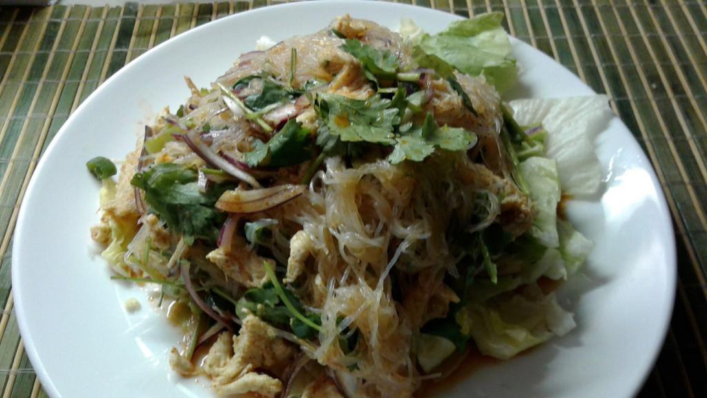 Rainbow Salad · Boiled chopped chicken and crystal noodles tossed with light chili lime juice, cilantro, red and green onion.