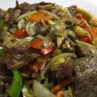 Ginger Beef · Beef sautéed with fresh ginger, light garlic, carrots, onion, green onion, mushrooms and bel...