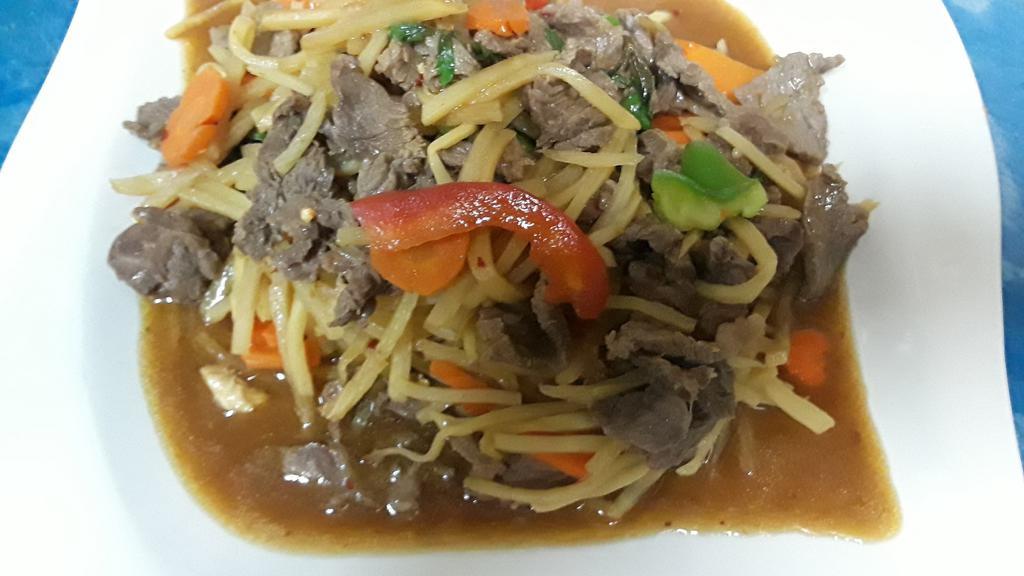 Basil Beef · Spicy. Beef sautéed with fresh chili, garlic, bamboo shoots, bell pepper and Thai basil leaves.