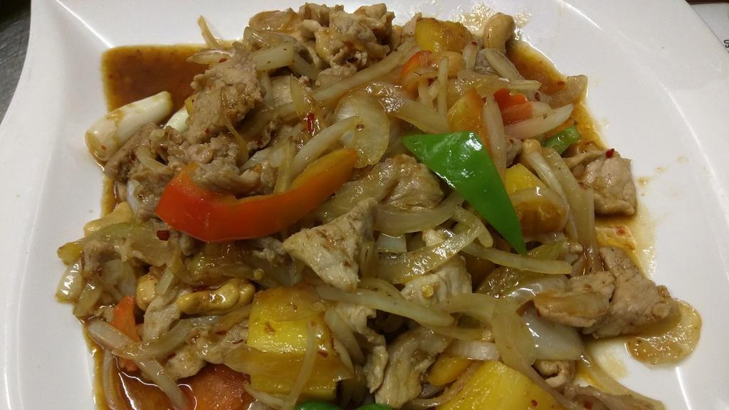 Bangkok Pork · Pork sautéed in fresh garlic, onion, bell pepper, cashew nuts, pineapple and sweet chili paste.