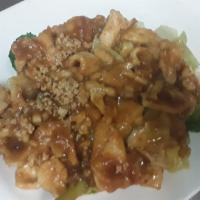 Rama Thai Pork · Pork over steamed vegetables topped with peanut sauce.