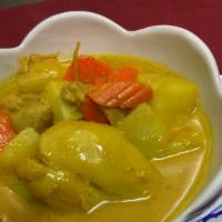 Yellow Curry · Tendered chicken simmered in yellow curry paste, coconut milk, potatoes and carrots; served ...