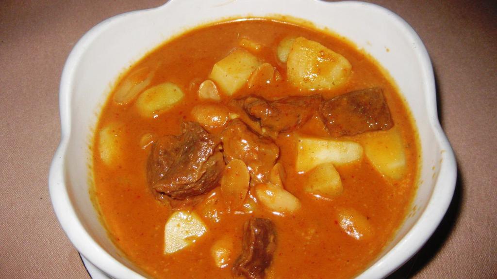 Peanut Beef Curry · Chunks of tendered beef simmered in special curry paste with peanut, coconut milk and potatoes.