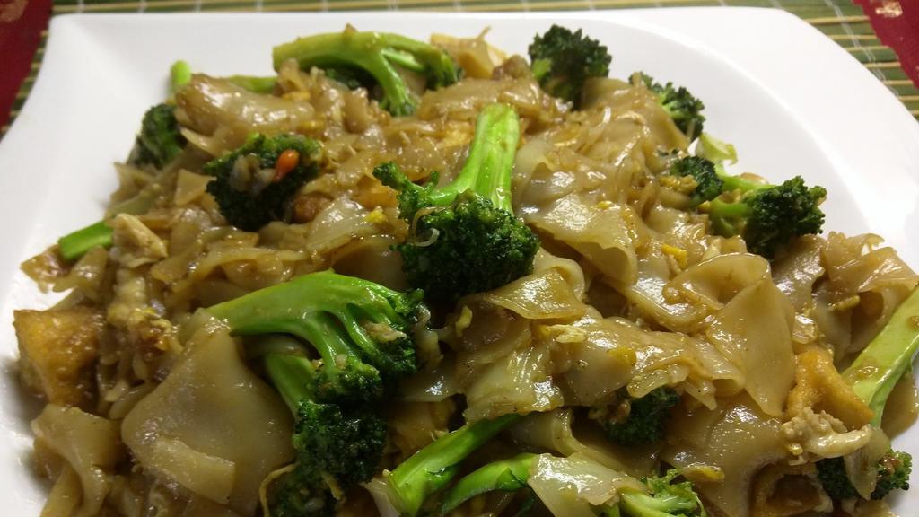 Pad See-Ew Chicken · Pan stir fried wide rice noodles with chicken,sweet soy sauce, broccoli and egg.