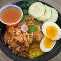 Golden Chicken (Seasoned Rice) · Crispy Chicken over seasoned rice served w/ a boiled egg and sweet and sour sauce.