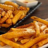 Cajun Fries · French Fries in a different light seasoned with cajun powder & spice delight.