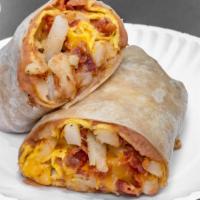 Breakfast Burrito · (Eggs, beans cheese papas and green chile sauce) (choice of meat bacon ham sausage or carne ...