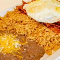 Chilaquiles · Lightly fried tortilla chips simmered in red or green sauce with eggs. Served with rice and ...
