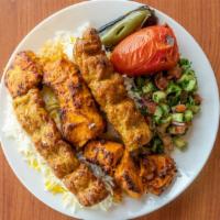 Chicken Soltani · A & H Shawarma favorite: Served with pita bread, basmati rice, grilled tomato, jalapeño and ...
