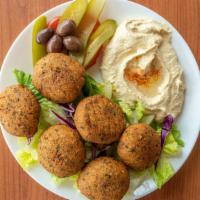 Falafel Plate · Ground chickpeas and fava beans with herbs. Served over lettuce, with tomato, onion, olives,...