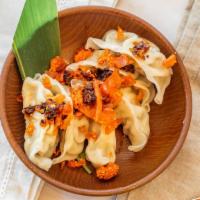 Steam Dumplings With Xo · Pork and chicken, served with savory XO chili sauce.