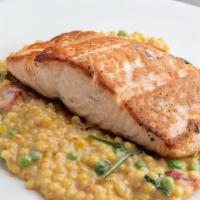 Pan Seared Salmon Lunch · Saffron Israeli couscous, oven dried tomatoes, spinach, fresh peas and orange glaze.