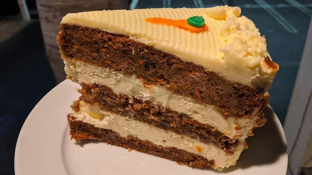 Carrot Cake · 3-Layer sliced cake with cream cheese frosting.