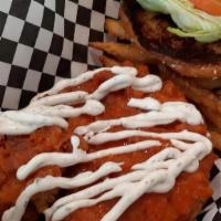 Buffalo Crispy Chicken Sandwich · The Crispy Chicken is tossed in Buffalo Sauce then topped with our Ranch.