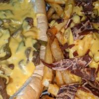 Philly Cheesesteak Sandwich · Sliced steak, grilled peppers & onions covered with 'whiz' cheese, on a long soft sub roll. ...
