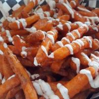 Buffalo Fries · Fries tossed in Buffalo Sauce with Ranch drizzled all over!