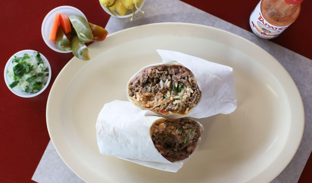 Carne Asada Burrito · includes carne asada, beans, rice, onions & cilantro, salsa