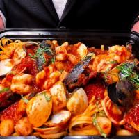 Seafood Linguine Pasta · Mussels, calamari, shrimps, clams, white fish fillet, marinara.