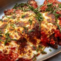 Chicken Parmigiana · Breaded chicken breast, marinara, mozzarella and fresh basil