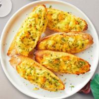 Cheesy Grim Garlic Bread · (Vegetarian) Housemade bread toasted and garnished with butter, garlic, mozzarella cheese, a...