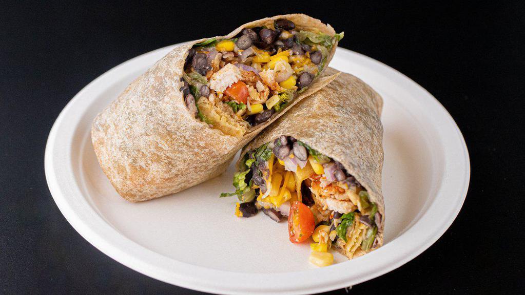Bbq Chicken Wrap · Crisp romaine lettuce, grilled skinless chicken breast, tomatoes, corn kernels, black beans, red onion, Monterey Jack cheese and Cheddar cheese and crispy garlic tortilla strips wrapped in wheat tortilla. BBQ sauce and buttermilk ranch for dressings.