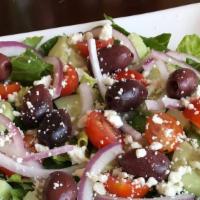 Greek Salad · Crispy romaine, lettuce, red onion, cucumber, cherry, Kalamata, olives, feta cheese.