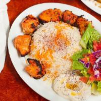 Shish Taouk (Chicken Kabob) Plate · Freshly marinated, charbroiled chicken breast cubes served with rice, green salad, Planet's ...