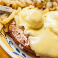Eggs Benedict · Three poached eggs atop a grilled English muffin, ham and a creamy hollandaise sauce. Served...