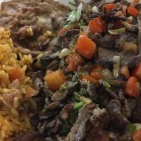 Steak Picado · Picado plate comes with beans, rice and salsa.