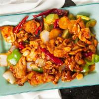 Kung Pao Chicken · Hot and spicy. Wok-seared chicken, peanuts, dry chili peppers and bell peppers, stir fried i...