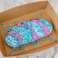 Mermaid Toast · Sourdough toast with spirulina and beet cream cheese. Topped with sprinkles and edible flowe...
