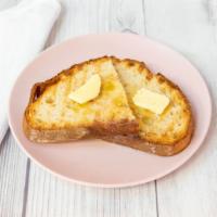 Toast With Butter · Toasted sourdough bread and butter on the side