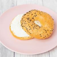 Everything Bagel · Everything (sesame seeds, poppy seeds, and onion) bagel toasted with a side of cream cheese.