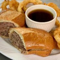 French Dip (With Au Jus) · Roast beef cooked daily in house, sliced thin, piled high on a soft French roll served with ...