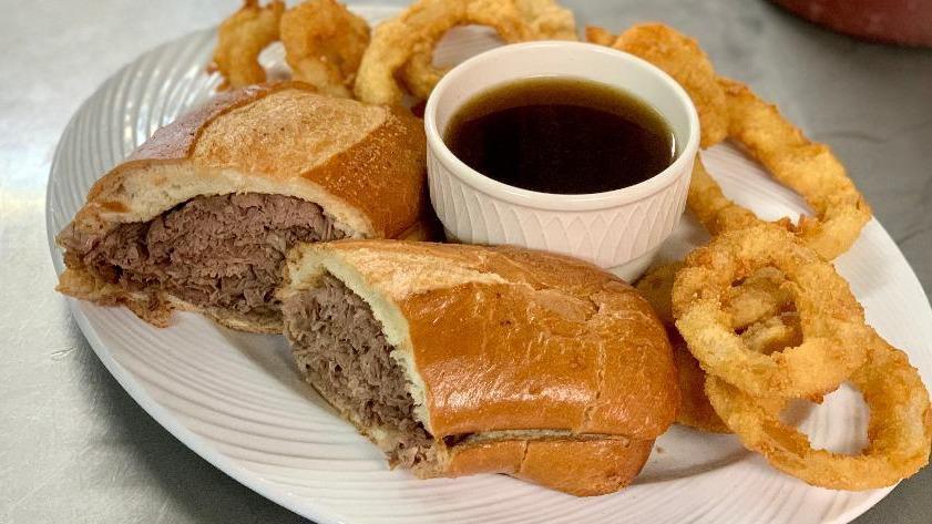 French Dip (With Au Jus) · Roast beef cooked daily in house, sliced thin, piled high on a soft French roll served with in house cooked au jus .