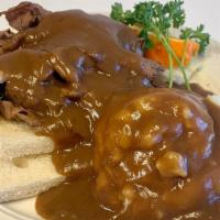Open Faced Hot Roast Beef Sandwich  · Open Sandwich with roast beef piled high over white bread and covered in brown gravy